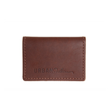 Urban Southern showcases their brown leather cardholder wallet with visible stitching.
