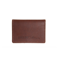Urban Southern showcases their brown leather cardholder wallet with visible stitching.
