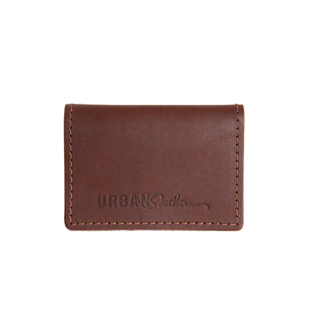 Urban Southern showcases their brown leather cardholder wallet with visible stitching.
