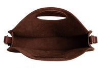 A brown leather tote bag displays its open interior.
