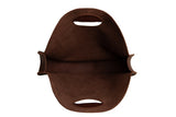 View shows the interior of a brown suede leather tote bag with handles.
