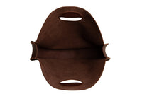 View shows the interior of a brown suede leather tote bag with handles.
