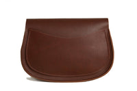 A brown leather crossbody bag sits against a white background.
