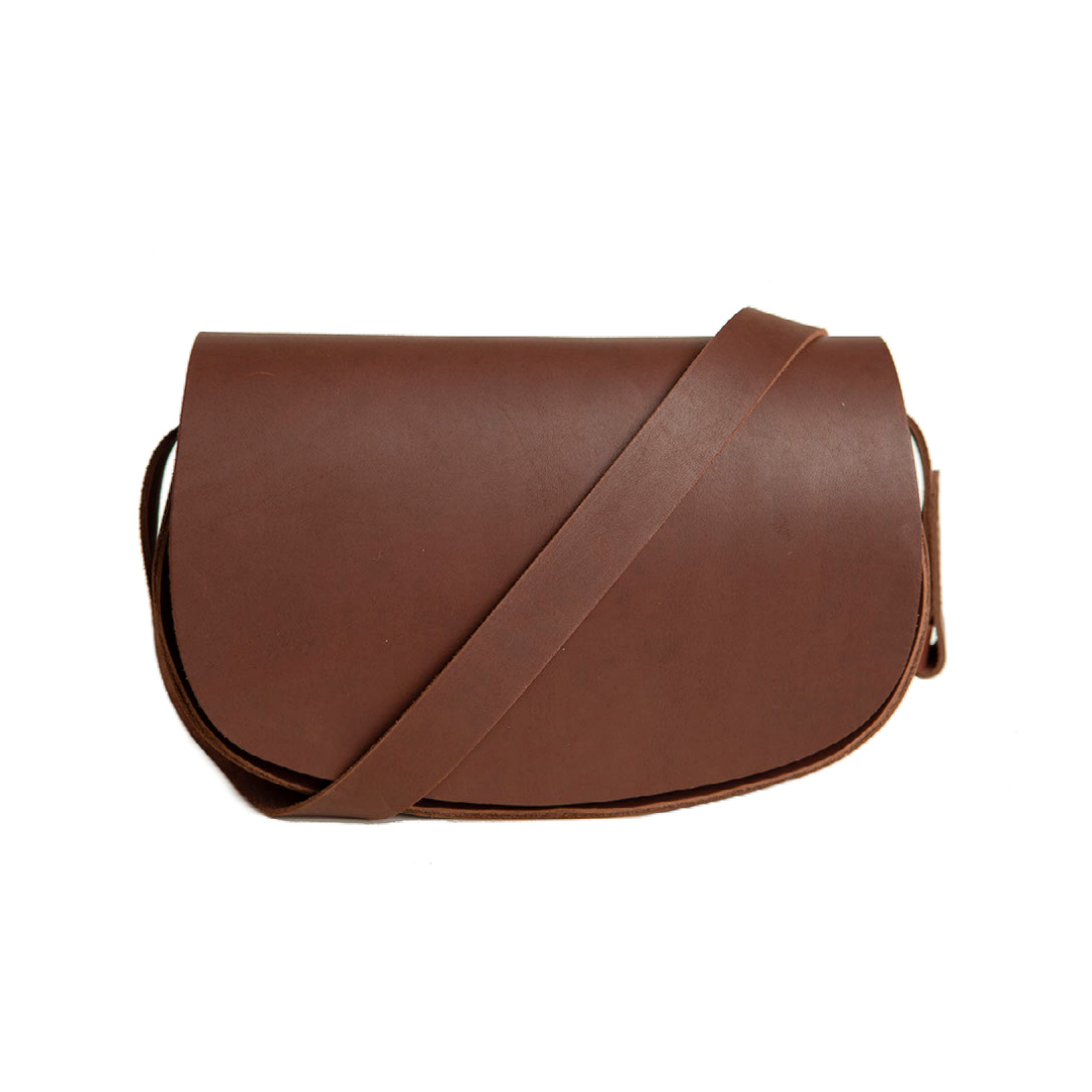 A brown leather crossbody bag displays its simple, stylish design.
