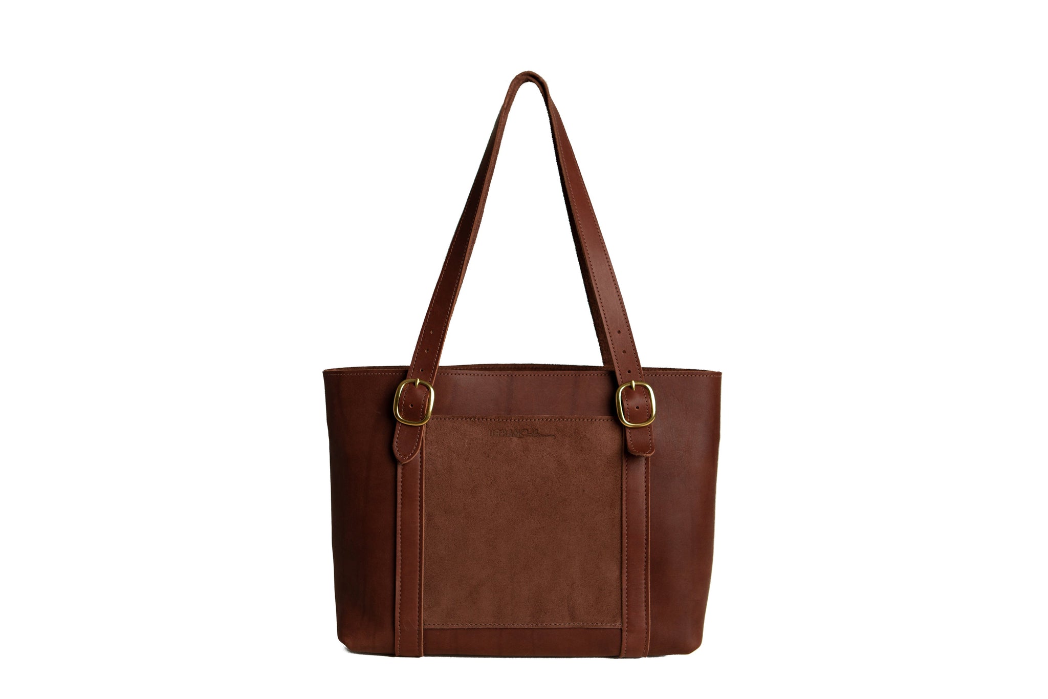 Showcases a stylish brown leather tote bag featuring gold buckle details and a suede panel on a white background.
