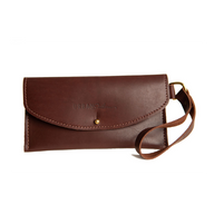 Showcases a stylish brown leather wallet clutch with wrist strap, embossed with the "Urban Southern" logo.
