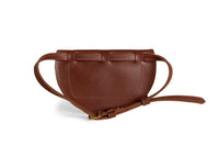 Close-up shows a stylish brown leather belt bag with an adjustable strap and buckle.
