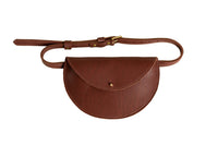 Showcases a stylish brown leather belt bag featuring a rounded flap and brass hardware.
