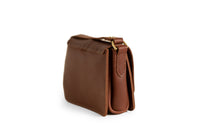 A luxurious brown leather satchel purse displays fine stitching and gold hardware details.
