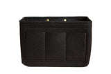 A black felt purse organizer features multiple compartments.

