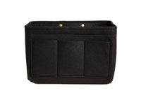 A black felt purse organizer features multiple compartments.
