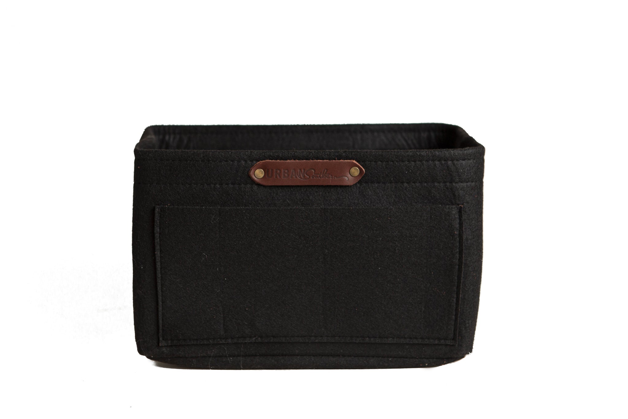 A black felt purse organizer with multiple pockets displays the "Urban Southern" logo on a leather tag.
