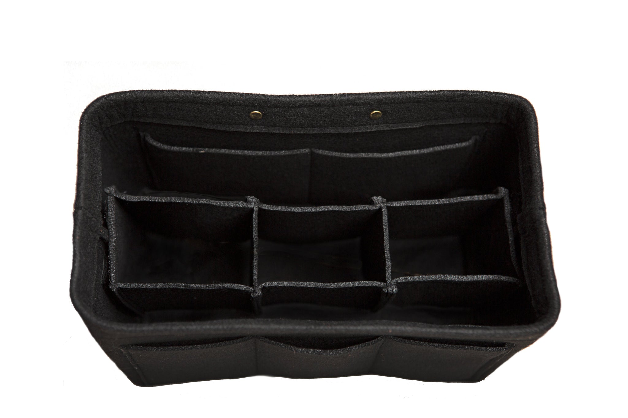 A black felt purse organizer insert with multiple compartments sits empty against a white background.
