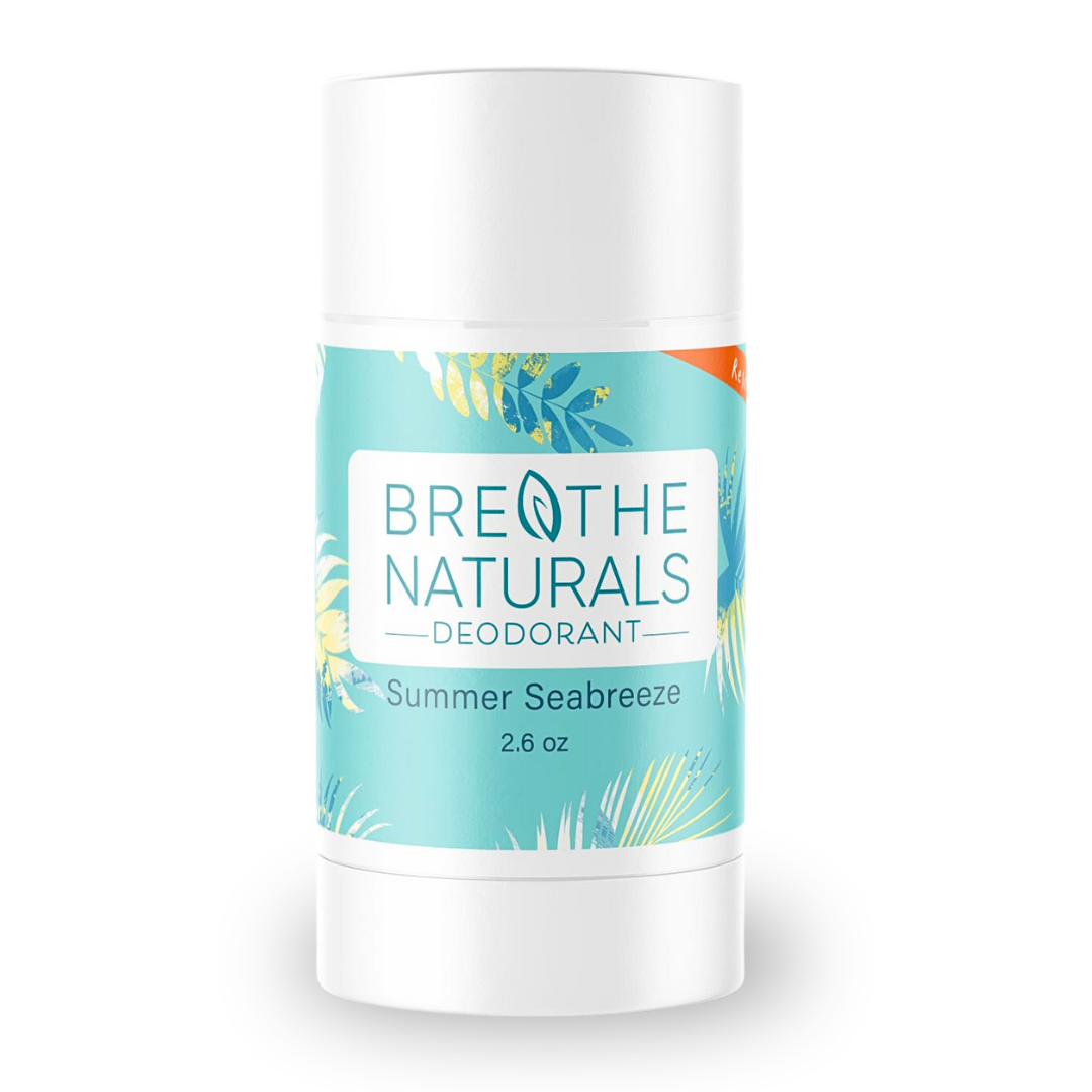 Breathe Naturals deodorant stick displays its Summer Seabreeze scent in a white container with a tropical leaf design.
