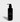 Showcases Jack Henry's Super Face Cleanser, a stimulating and exfoliating face wash with kakadu plum, citrus, and coriander leaf extracts, presented in a sleek black bottle.
