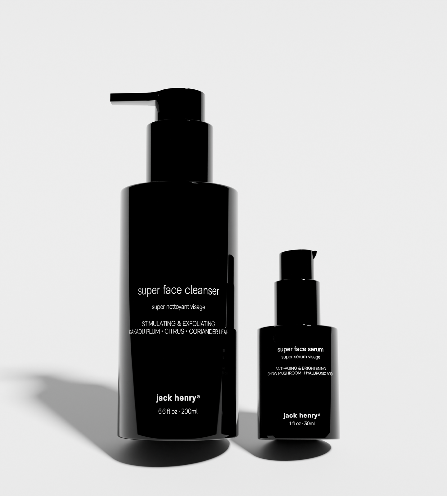 Jack Henry presents their Super Face Cleanser and Super Face Serum skincare products in sleek, black bottles.
