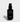 Jack Henry Super Face Serum, an anti-aging and brightening skincare product, sits against a white backdrop.
