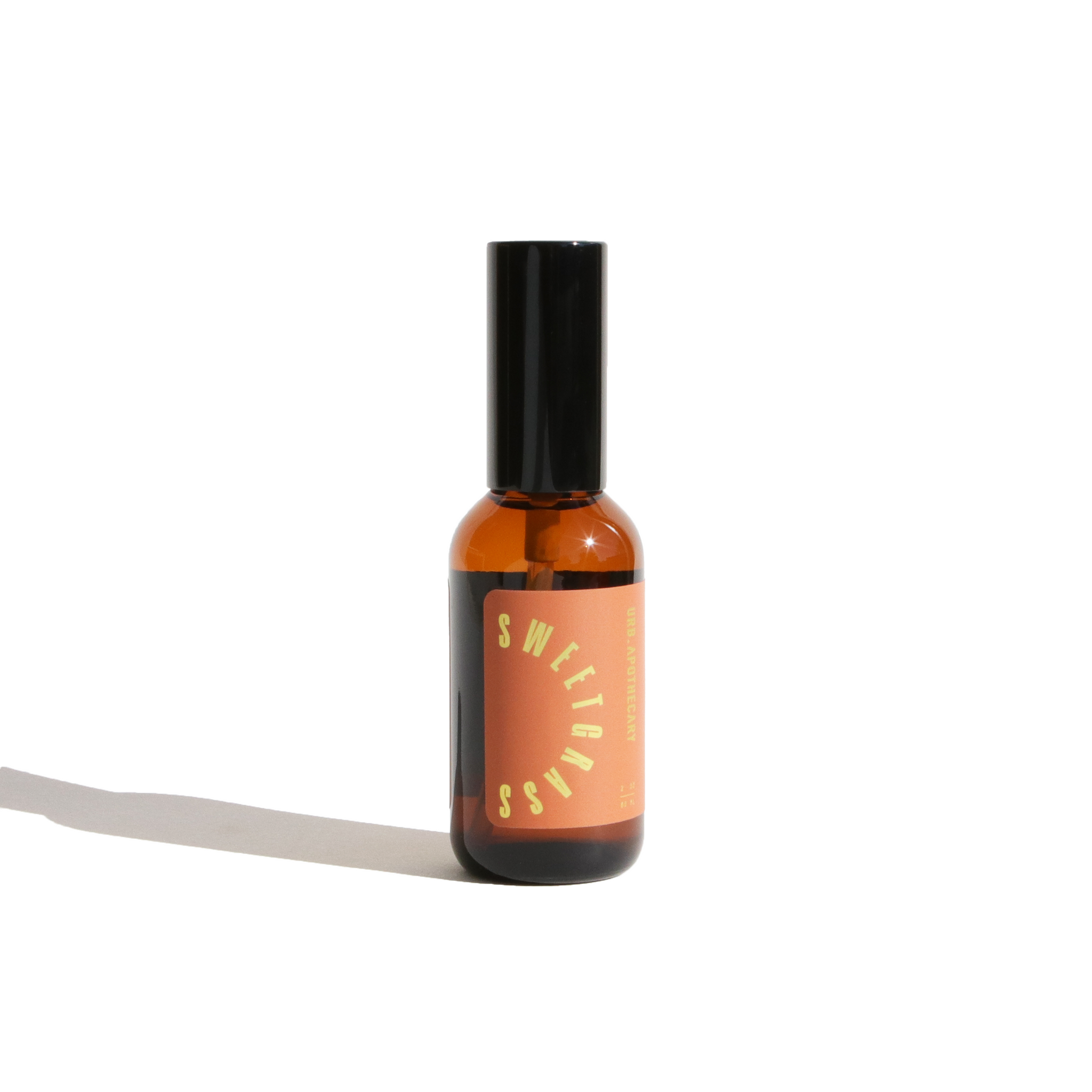 Showcases a bottle of Sweetgrass aromatherapy room spray by URB Apothecary.
