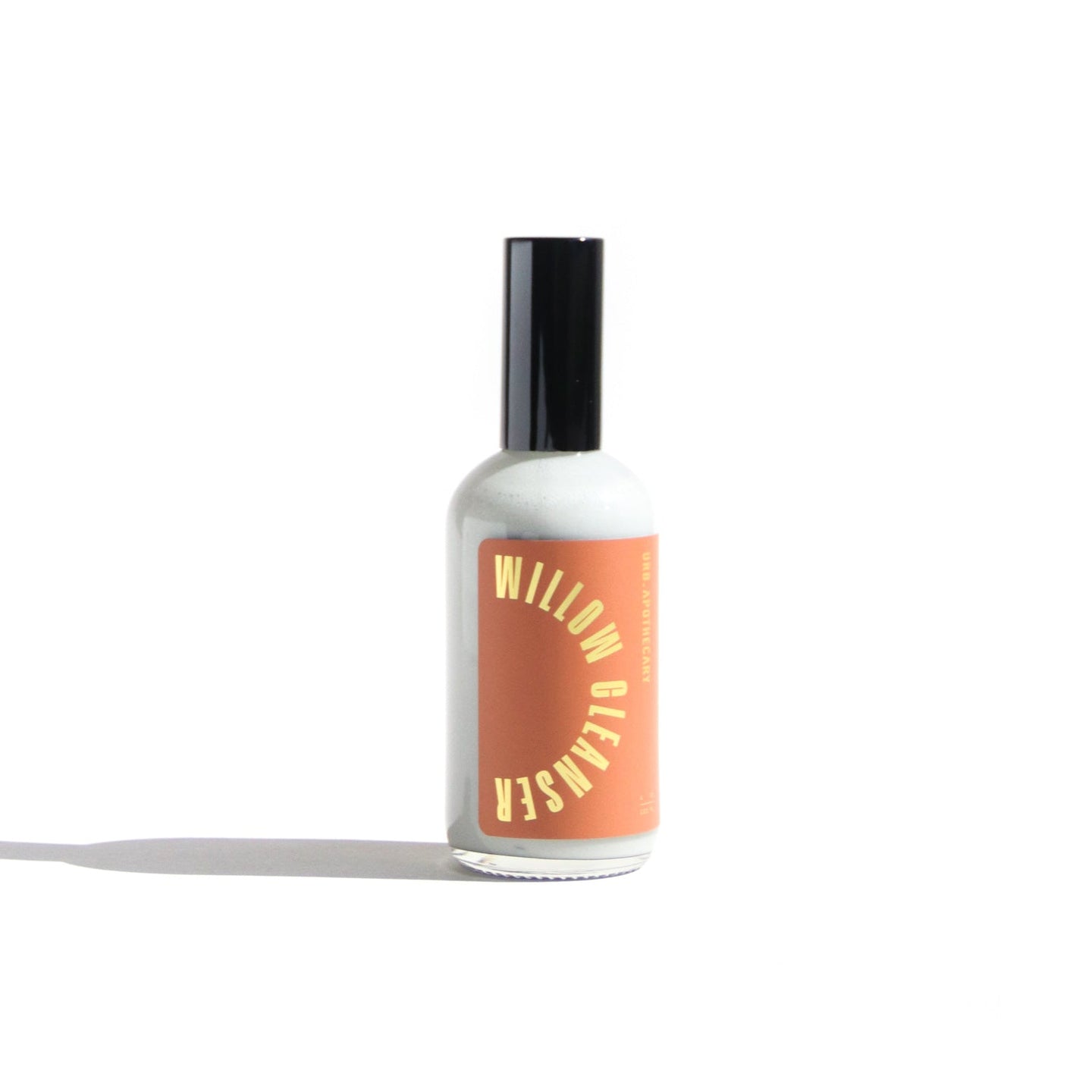 A bottle of Willow Mottim Cleanser sits on a white surface.
