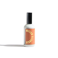 A bottle of Willow Mottim Cleanser sits on a white surface.
