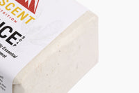 Ascent Nutrition's Juice Soap, a holistic essential oil bergamot cleanser, sits wrapped in labeled packaging.
