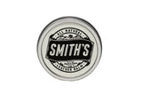 Smith's All Natural Leather Balm in a metal tin protects and conditions leather goods.
