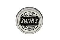 Smith's All Natural Leather Balm in a metal tin protects and conditions leather goods.

